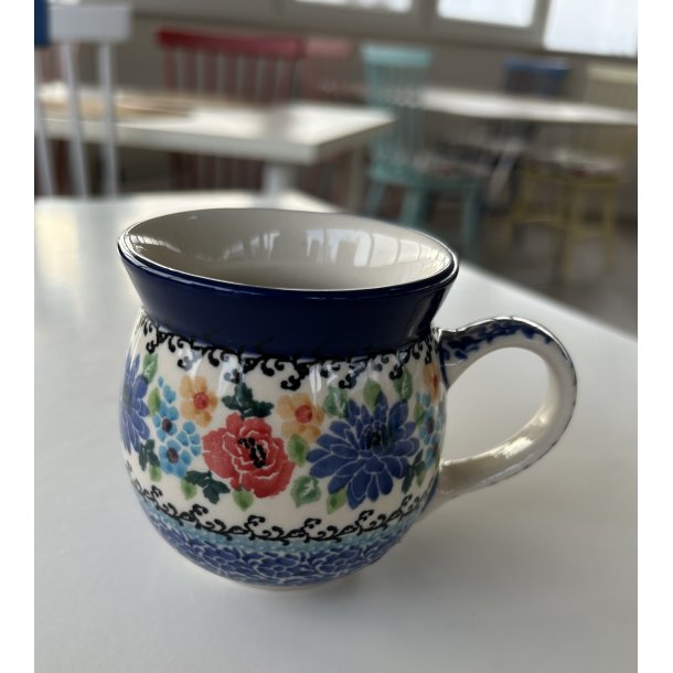 Kop i polsk stentj med farverige blomster 